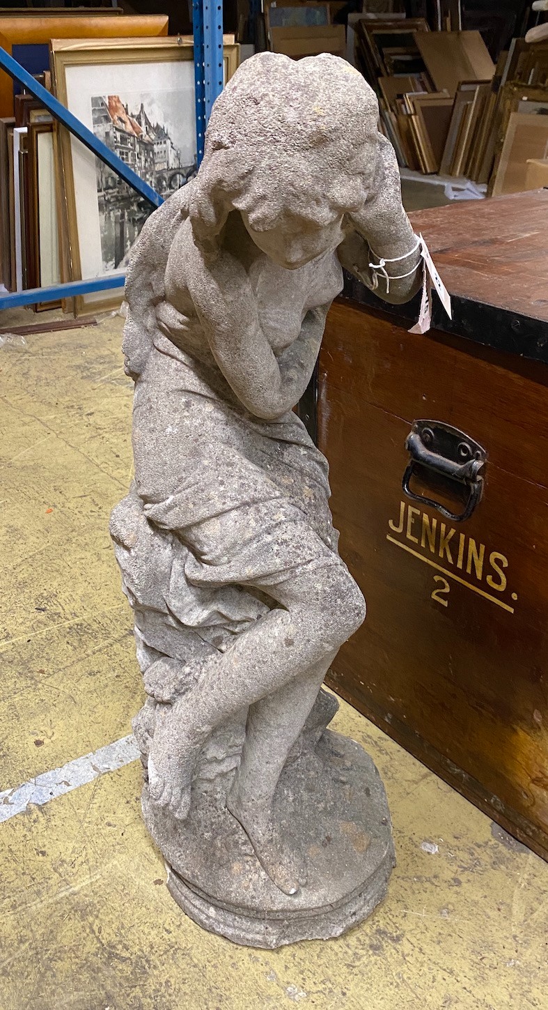 A reconstituted stone garden ornament of a female bather, height 84cm